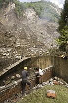 Giant Panda (Ailuropoda melanoleuca) enclosure rebuilt by workers after the May 12, 2008 earthquake and landslides, CCRCGP, Wolong, China
