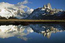 Cerro Torre and Fitzroy reflected in small pond at dawn, Loma Plieque Tumbado, Los Glaciares National Park, Patagonia, Argentina