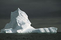 Grounded iceberg with storm clouds overhead, Pleneau Island, Antarctic Peninsula, Antarctica