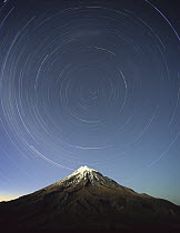 Star trails around the south celestial pole over Mt Taranaki, also known as Mt Egmont (8,261 feet) a dormant volcano in the southwest corner of the North Island near the Tasman Sea, Egmont National Pa...