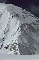 Skier on central Rongbuk Glacier, underneath the west ridge of Mount Everest during an ascent of the north face, Tibet