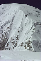 Skier descends Central Rongbuk Glacier with Mount Everest in the background, Tibet