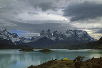 Camper looking at Horns of Paine Mountains, Torres del Paine National Park, Patagonia, Chile