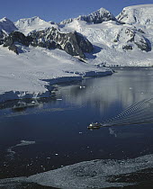 Tourist cruise ship leaves Paradise Bay, Antarctic Peninsula, a view from summit Mount Don Roberts, Antarctica