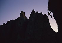 Climber silhouetted on Chain Reaction, a 5.12c route, Smith Rocks, Oregon