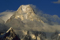 Gasherbrum IV (7,925 meters) showing west face amid clouds, Karakoram Mountains, Pakistan