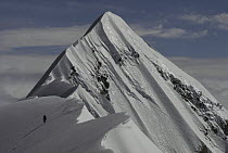 Climber soloing the summit of Mount Cook, Grand Traverse, Mount Cook National Park, New Zealand