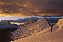 Hiker at sunset on Chinchey Massif, Cordillera Blanca, Peru