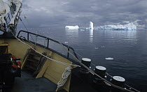 Tour boat passing close to icebergs, Gerlache Strait, Antarctica