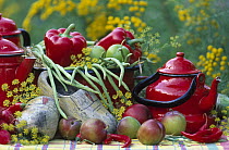Still-life of red fruits and vegetables, clogs, and green beans