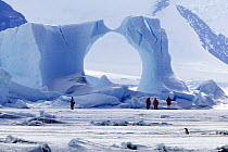 Tourists looking at ice formation, Antarctica