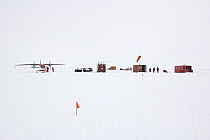 Research station with airplane and researchers, Antarctica