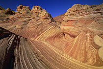 Colorful sandstone buttes with strong pattern of wavy lines exposed by erosion, Vermilion Cliffs National Monument, Colorado Plateau, Utah