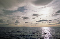 Lenticular clouds in morning near coastal Torngat Mountain, summer, Labrador Sea, northern Labrador, Canada