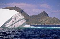 Iceberg drifts past Torngat Mountain, summer season, Labrador Sea, Newfoundland, Canada