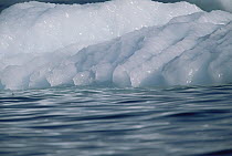 Details of iceberg showing grooves created by rising air bubbles, summer season, near Saint Anthony, Newfoundland, Canada