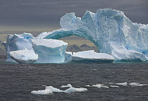 Giant iceberg arch formed by ice melting and wave action, Antarctica