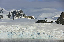 Coastal glacier descending to sea, Grandidier Passage, western Antarctica