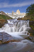Waterfalls of river flowing from glaciers and snow fields of Fitzroy Massif cascading over rocks, Andes, Los Glaciares National Park, Patagonia, Argentina