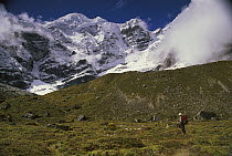 Trekker under Mera Peak, Hinku Valley, Makalu-Barun National Park, Nepal