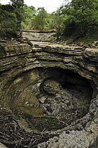 Giant sink hole during the dry season, Ankarana Special Reserve, northern Madagascar