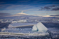 Mount Erebus at midnight with ice floes in McMurdo Sound, Ross Island, Antarctica
