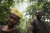 Baka boys making fiber crowns for a night ceremony, Cameroon