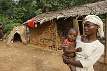 Baka woman with child, Cameroon