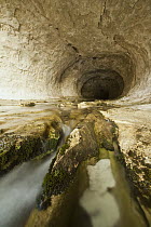 Creek flowing through limestone cave beneath Flock Hill, Canterbury, New Zealand