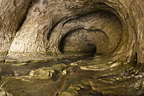 Creek flowing through limestone cave beneath Flock Hill, Canterbury, New Zealand