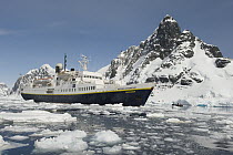 NGS Endeavour cruise ship near glacier and coastline, Antarctica