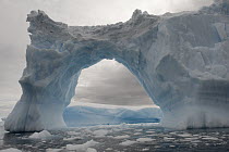 Iceberg with a natural arch, Antarctic Peninsula, Antarctica