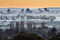 Smog and smoke from wood and coal fires at dawn blankets central city, Christchurch, Canterbury, New Zealand