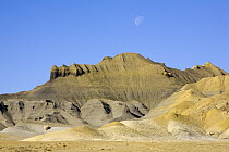 Moon over eroded sandstone bluffs, Henry Mountains, Utah