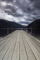Dock at Lake Rotoiti with stormy clouds, Nelson Lakes National Park, South Island, New Zealand
