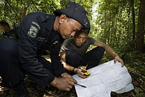 Rhino protection unit personnel patrolling in Way Kambas National Park, Sumatra, Indonesia