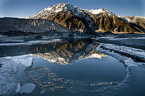 Reflection of Mount Wakefield in frozen Mueller Lake, Mount Cook National Park, New Zealand