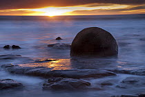 Round boulder in the surf, Moeraki Beach, South Island, New Zealand