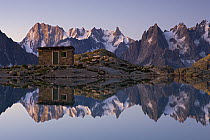 Mountain shelter at Lac Blanc with reflection of Mont Blanc, France