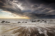 Moeraki boulders at dawn with storm clouds, Moeraki Beach, Otago, New Zealand