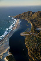 Hollyford River mouth and sand dune spit at sunset, Martin's Bay, Fiordland National Park, New Zealand