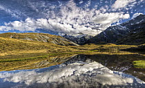 Mount Tyndall, reflection in tarn, Cascade Saddle, Mount Aspiring National Park, New Zealand