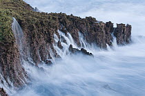 Water cascading down cliffs into ocean, Christmas Island National Park, Christmas Island, Indian Ocean, Territory of Australia