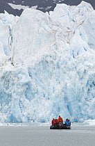 Zodiac takes travelers along glacier front, Monaco Glacier, Liefdefjorden, Svalbard, Norway