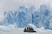 Zodiac cruises along face of Monaco Glacier, Leifdefjorden, Svalbard, Norway