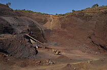 Red gravel mine used for construction and road building, highlands of Santa Cruz Island, Galapagos Islands, Ecuador