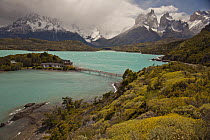 Hotel on small island in Lago Pehoe with Cuernos del Paine peaks above, Torres Del Paine National Park, Patagonia, Chile