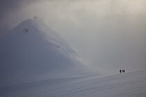 Climbers descend Jabet Peak in blizzard above Port Lockroy, Wiencke Island, Antarctic Peninsula, Antarctica