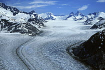 Glacier showing lateral and medial moraines in glacial valley, Alaska