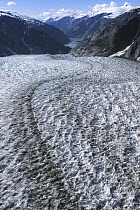 Glacier showing lateral and medial moraines in glacial valley, Alaska